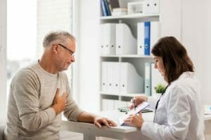 senior man with cardiologist
